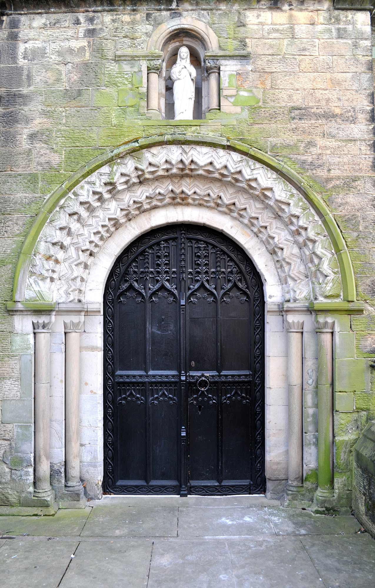 Norman zigzag decoration on one of the external doors -