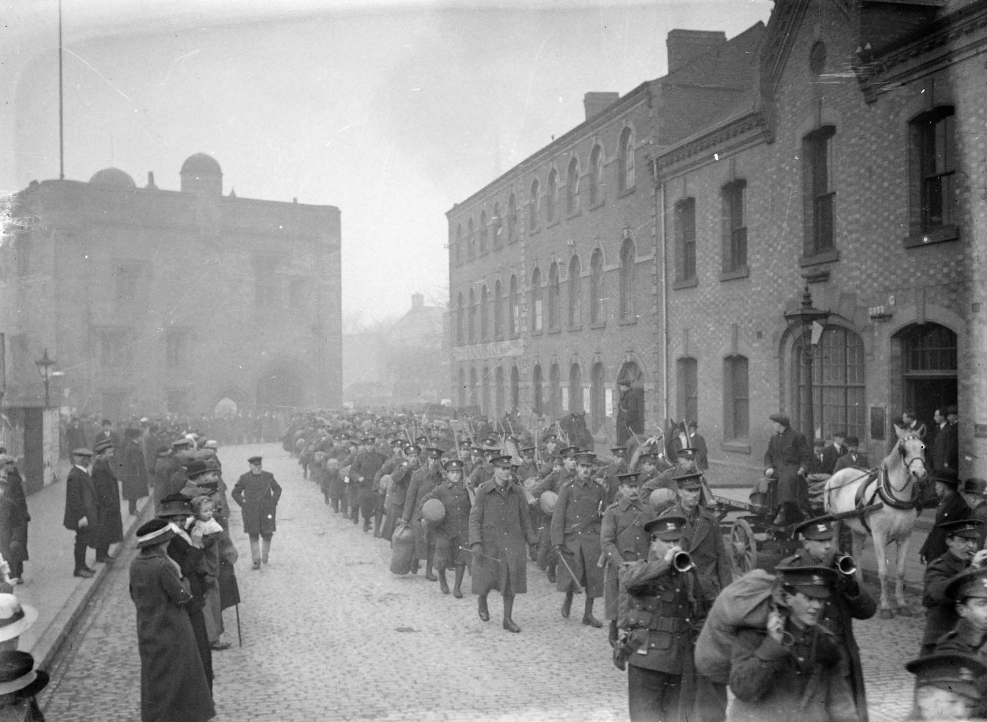 Fully accoutred troops of Leicestershire Regiment marching down Newarke Street, 1914 -