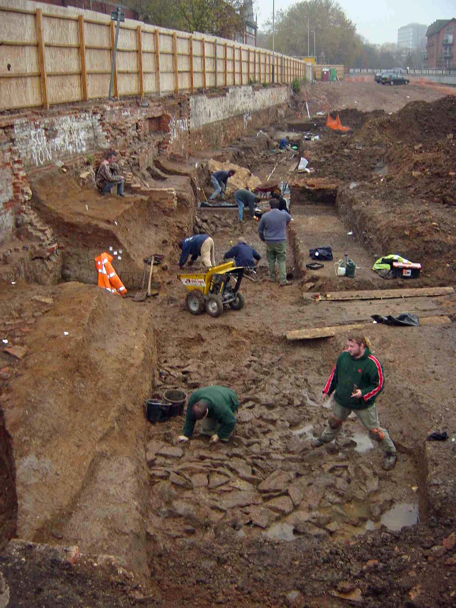 Archaeologists excavate a length of the medieval town defences on Bath Lane. Fallen masonry next to the wall and areas of scorched foundation were probably evidence of the 1173 siege - University of Leicester Archaeological Services