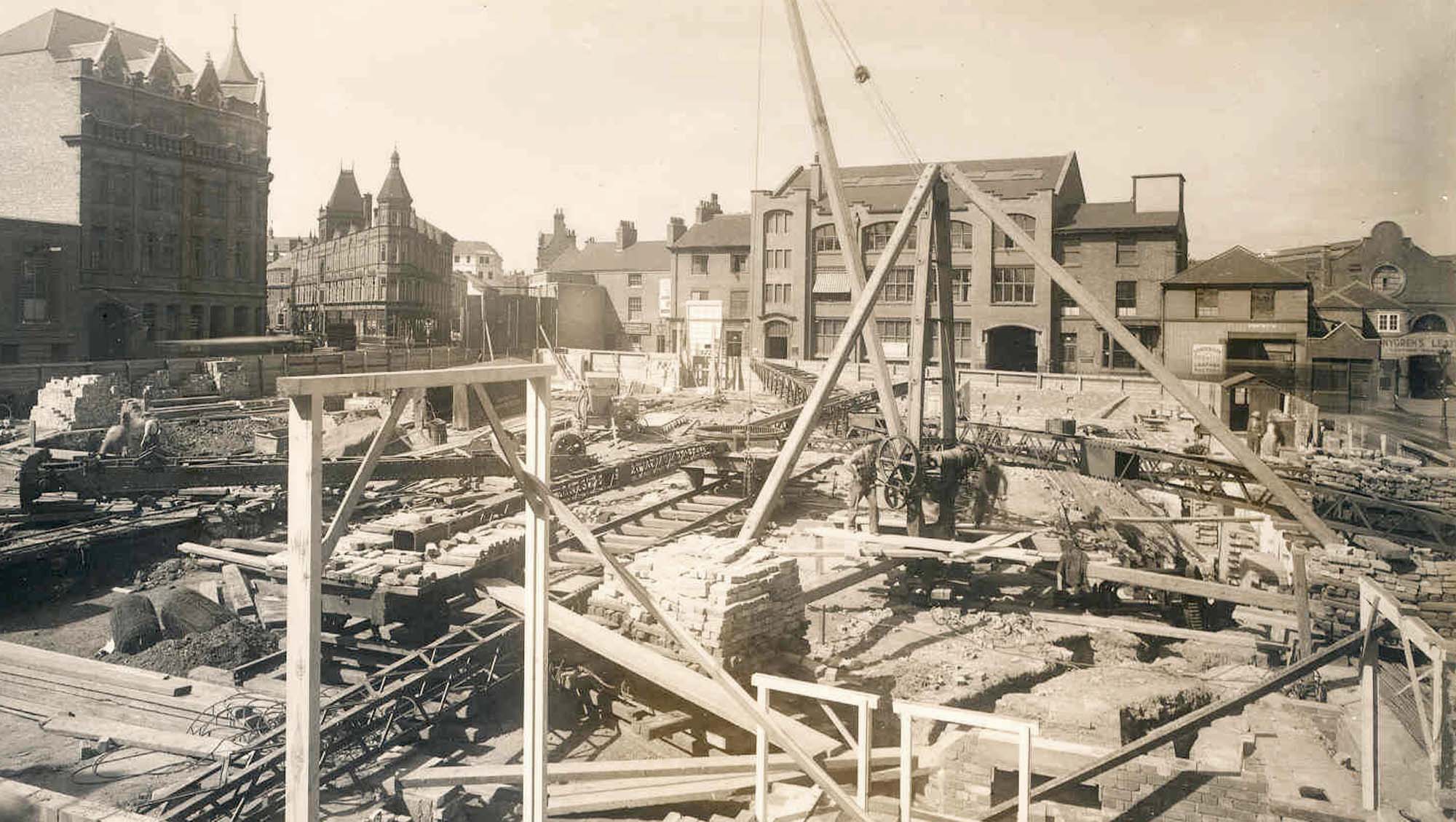 Looking across the Odeon Cinema construction site (1937) to the factory building that were replaced by the Curve -