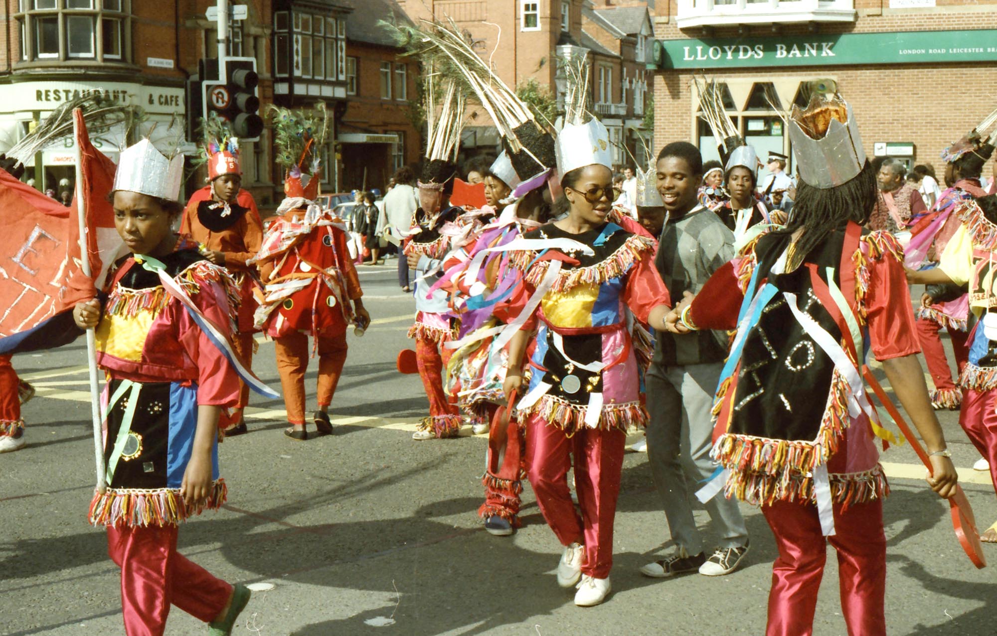 A dance troupe parading on London Road, 1986 -