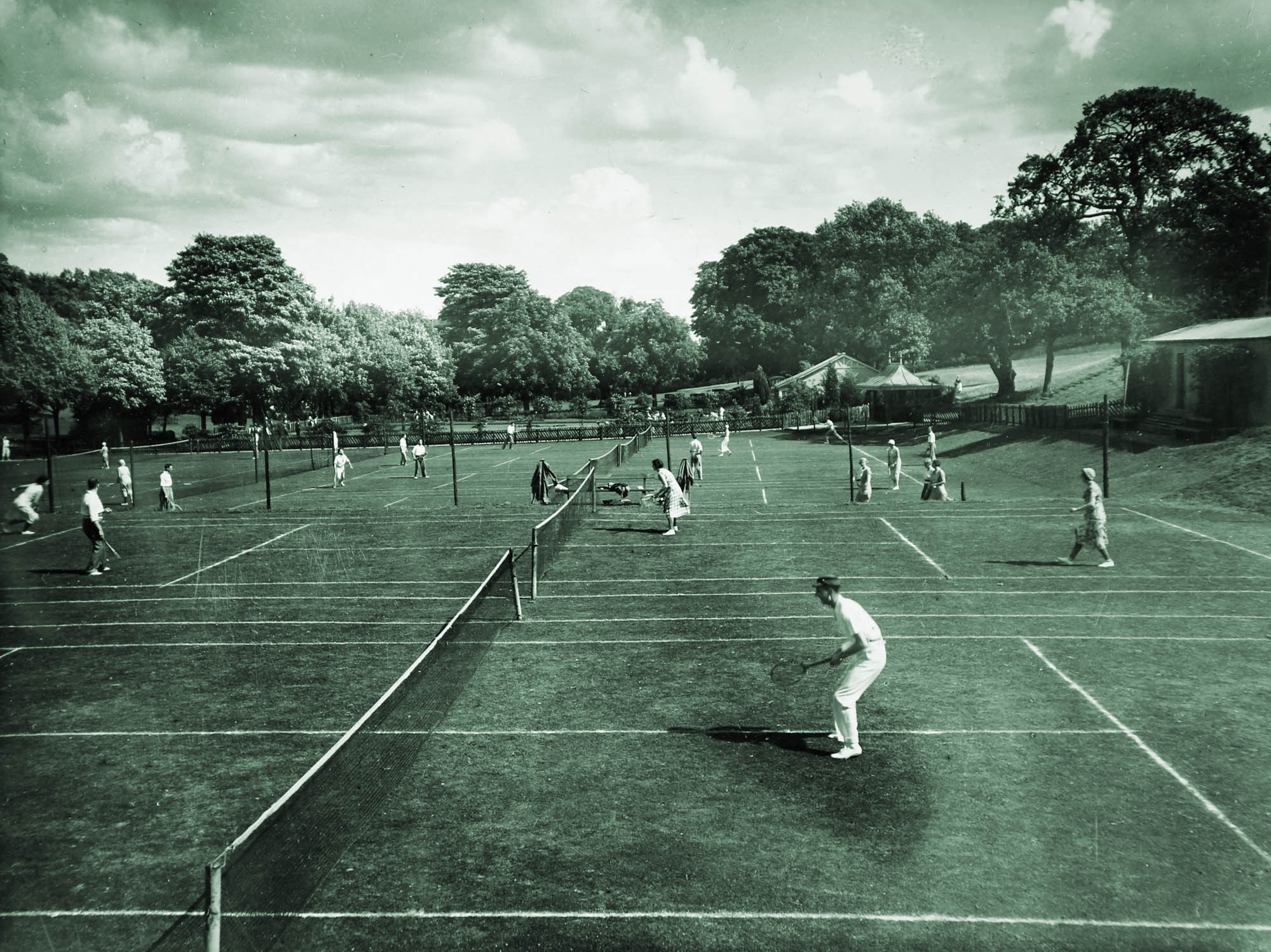 Busy tennis courts, circa 1950s - 