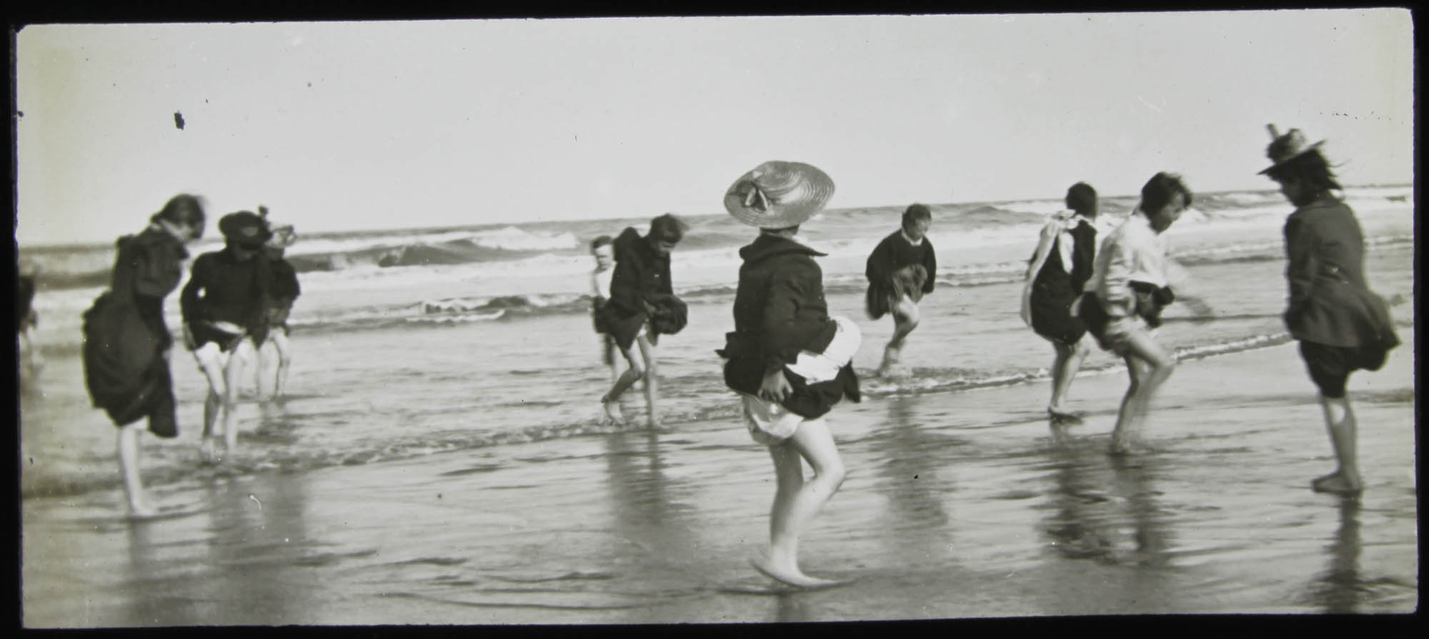 Girls paddling in the ocean -