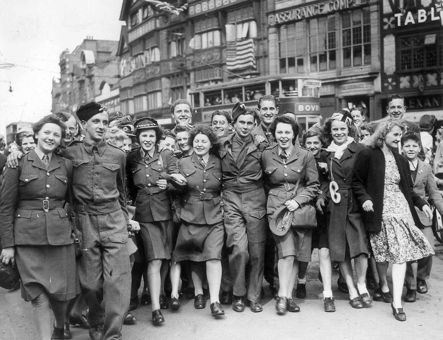 Celebrating near the Clock Tower in 1945. - Leicester Mercury