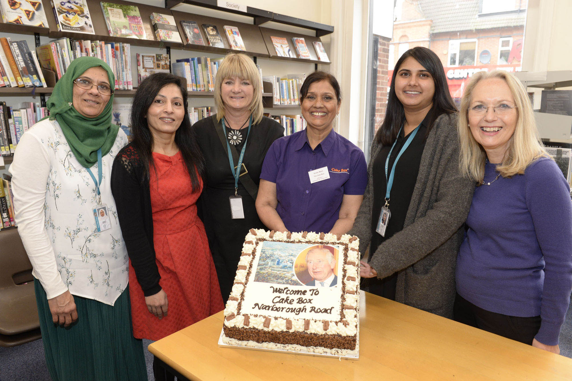 Leicester City Council staff with a cake to commemorate Prince Charles' visit -