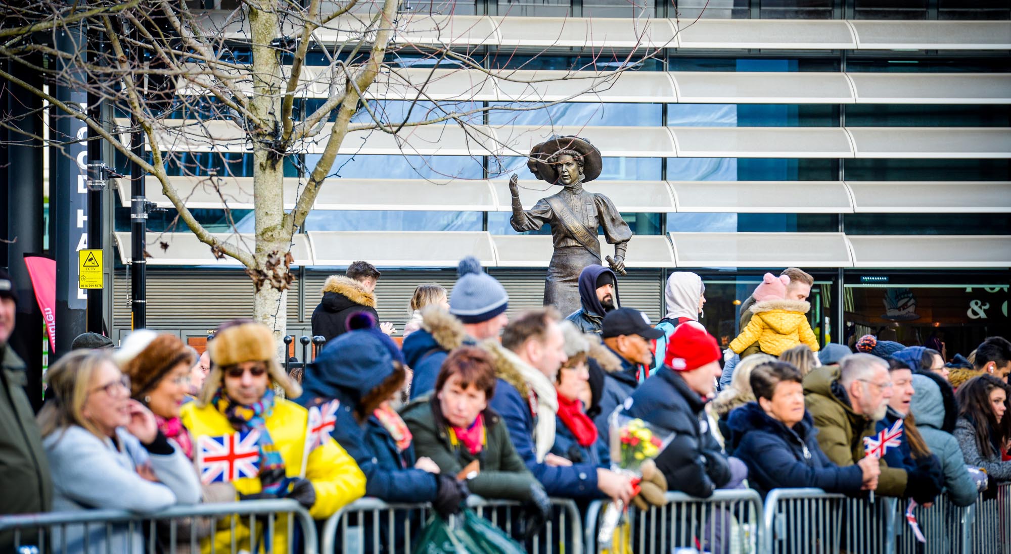Crowds await the arrival of Prince Charles, near the Alice Hawkins Statue in Green Dragon Square -